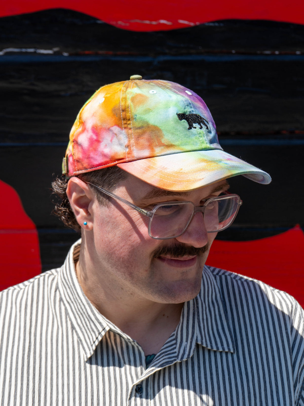 Person wearing Equator Coffees Pride Hat | Equator Coffees
