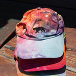 Stack of Equator Coffees Pride Hats | Equator Coffees