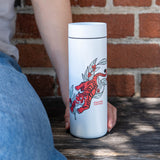 Harvest Tiger tumbler against a brick wall | Equator Coffees