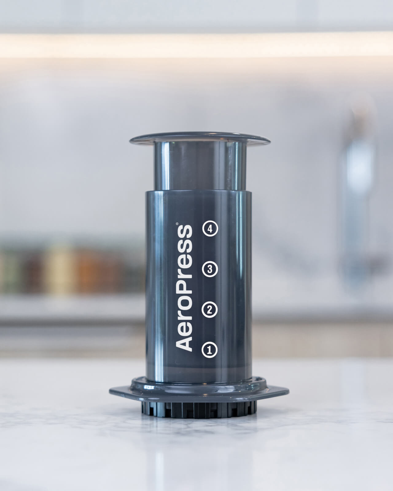 Displaying the AeroPress Original Coffee Maker on the kitchen counter before brewing | Equator Coffees