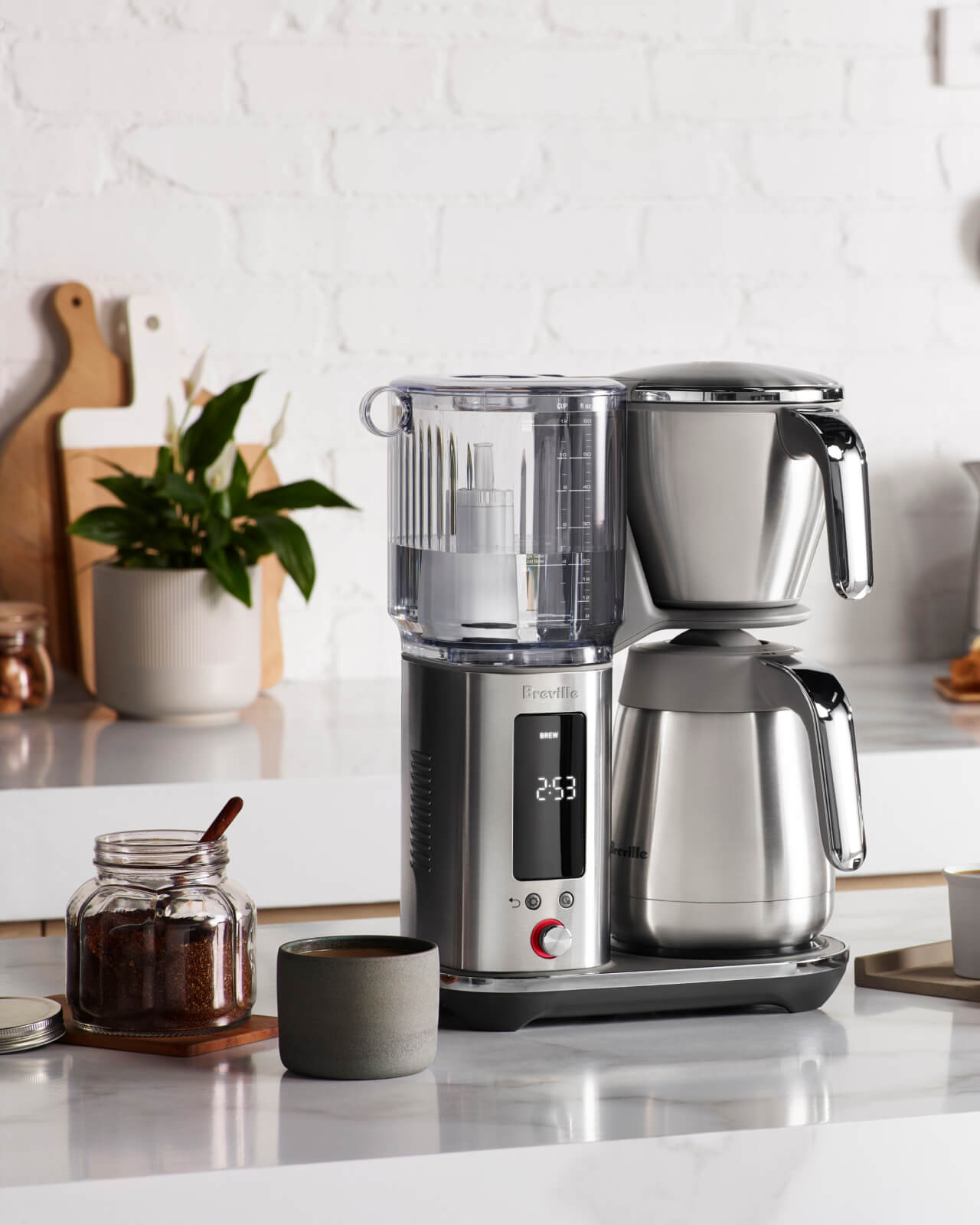 Breville Luxe Thermal Brewer at home on the kitchen counter with ground coffee and a ceramic mug | Equator Coffees