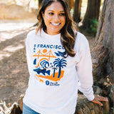 Woman wearing a white Parks Project x Equator Coffees sweatshirt | Equator Coffees