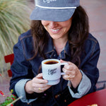 Enjoying freshly roasted coffee at a Marin cafe with the Equator Retro Milk Glass and Retro Corduroy Cap | Equator Coffees