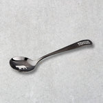 Equator Tiger Cupping Spoon on a grey background | Equator Coffees