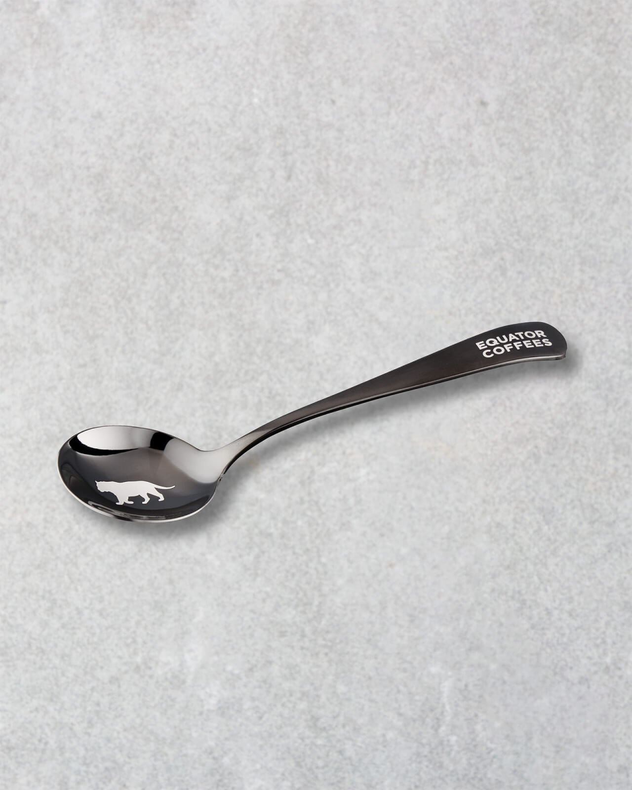 Equator Tiger Cupping Spoon on a grey background | Equator Coffees