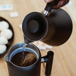 Pouring hot water into the Fellow Clara French Press for brewing | Equator Coffees