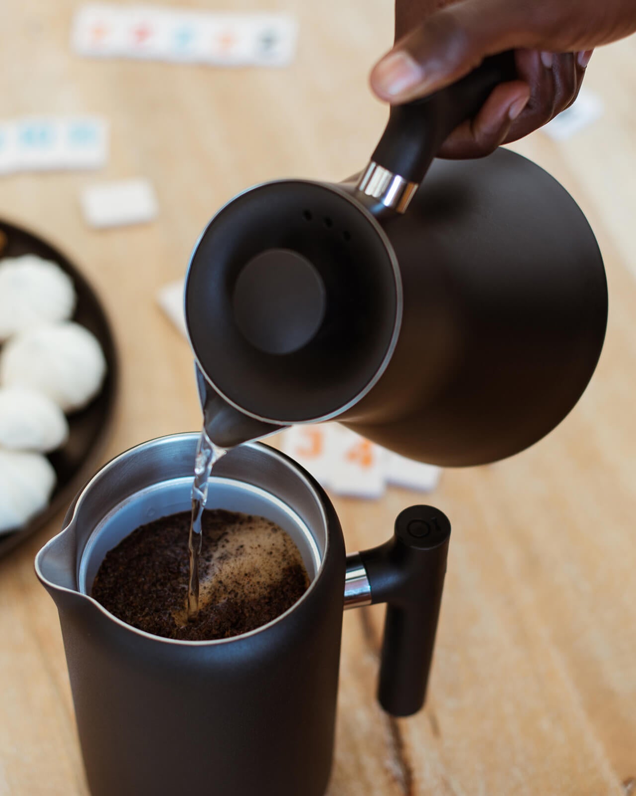 Pouring hot water into the Fellow Clara French Press for brewing | Equator Coffees