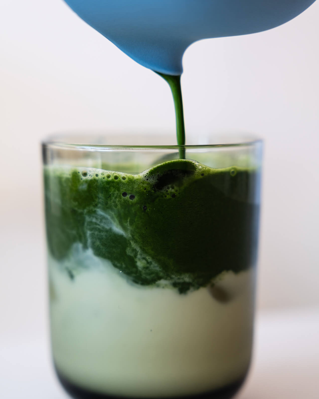 Fellow Matcha Set | Matcha being poured into a glass with ice | Equator Coffees