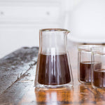 Fellow Stagg Double Wall Carafe | Fellow Coffee Carafe | Fellow Coffee Pitcher is ready to serve with two glass cups | Equator Coffees