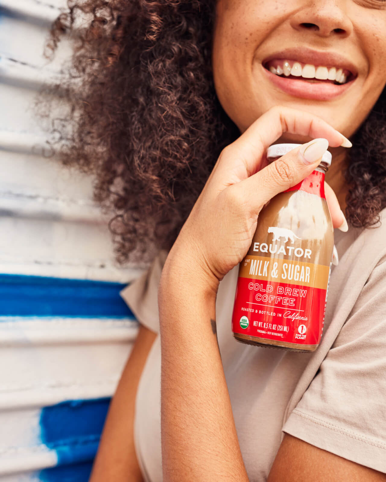 Happy and excited for a cold bottle of Hint of Milk & Sugar Organic Cold Brew Coffee | Equator Coffees