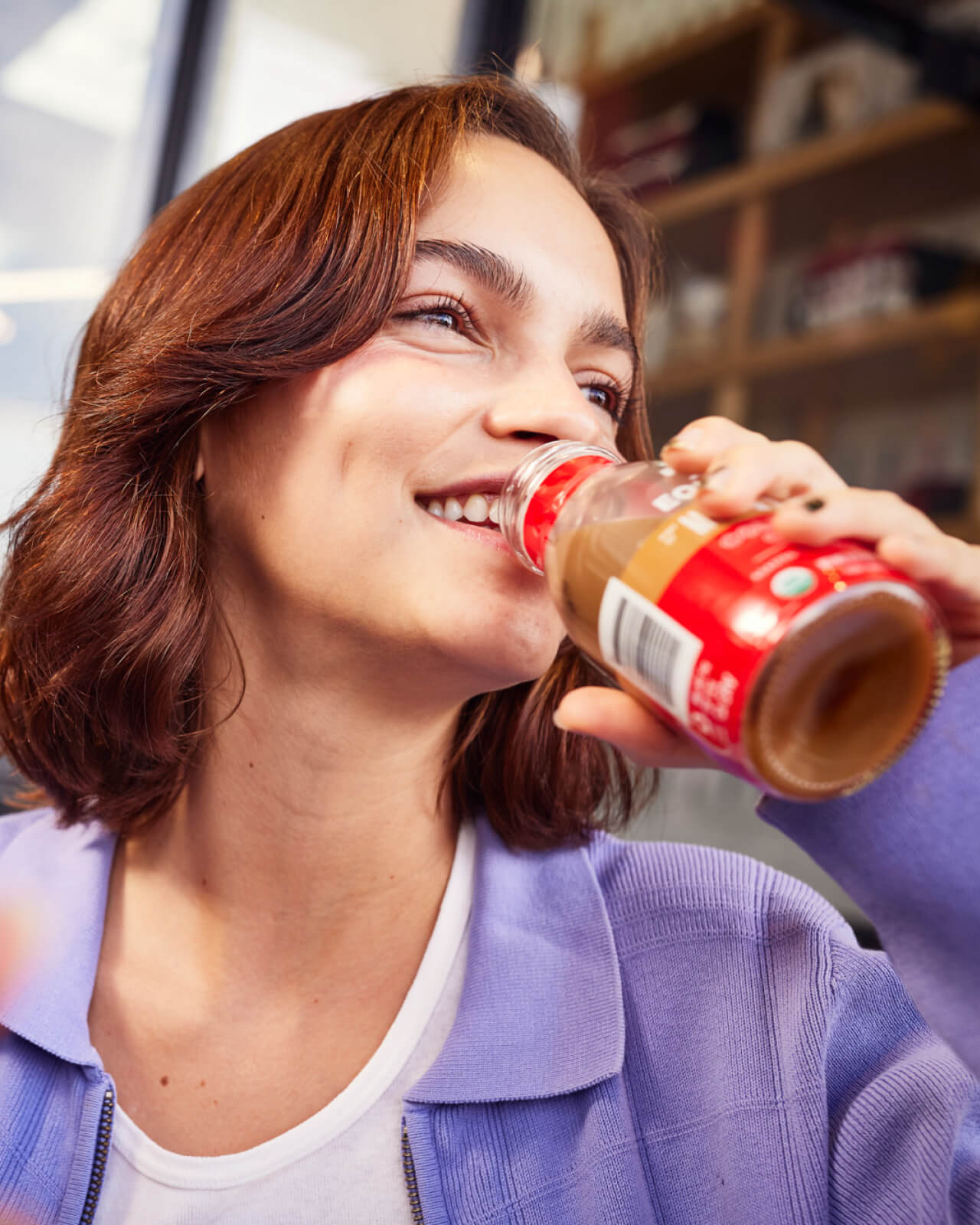 Sipping a Hint of Milk & Sugar Organic Cold Brew Coffee on a hot summer day | Equator Coffees