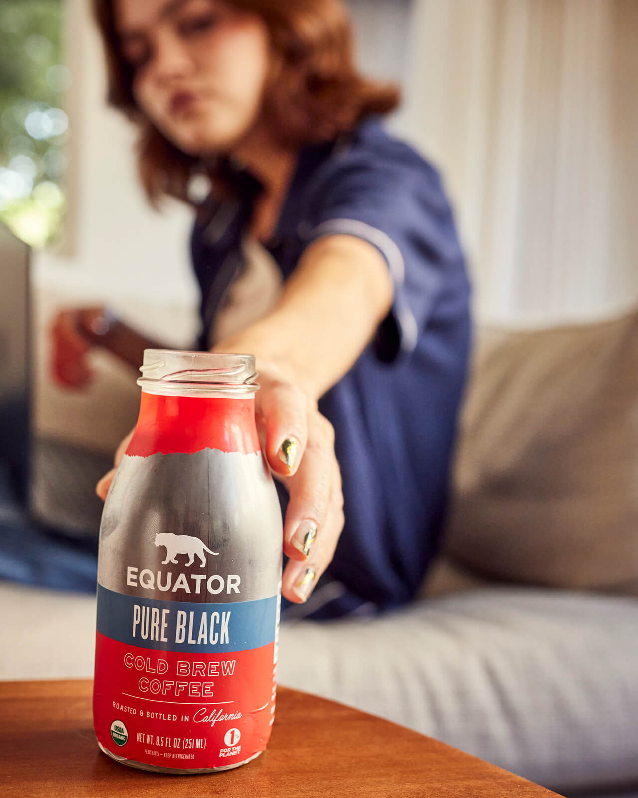 Reaching for a Pure Black Organic Cold Brew during a long study session | Equator Coffees