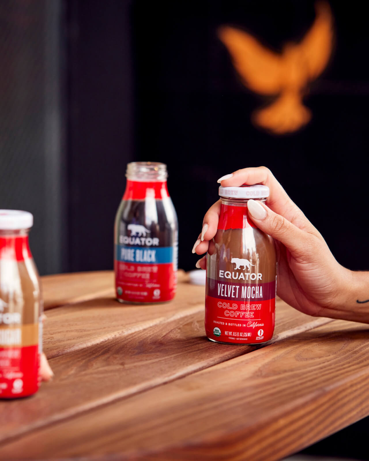 Opening up a refreshing bottle of Velvet Mocha Organic Cold Brew Coffee to enjoy during a day on the go | Equator Coffees